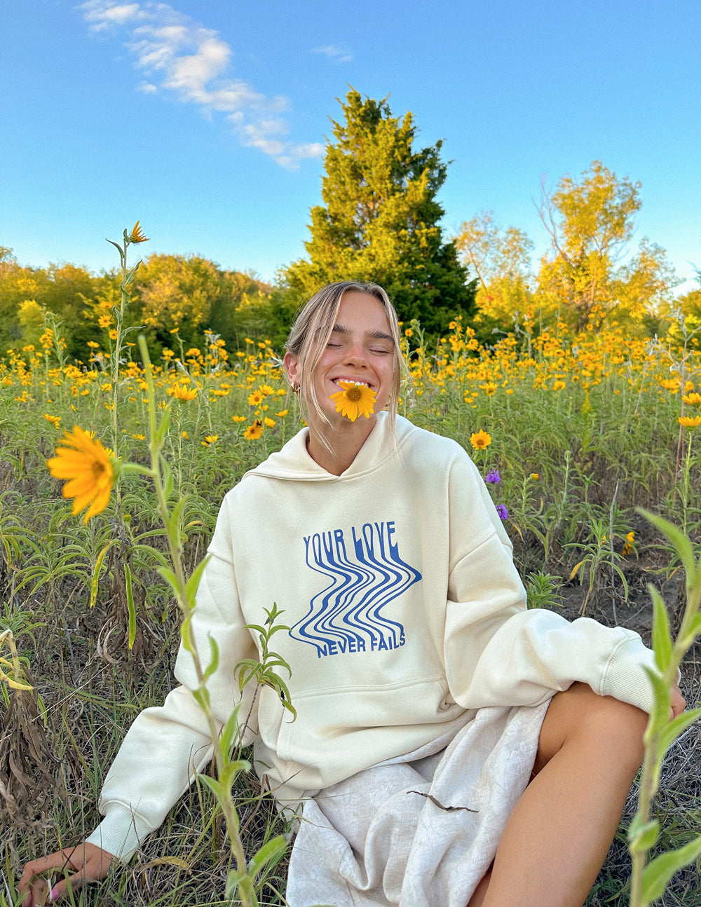 Elevated Faith Love Never Fails Cream Unisex Hoodie - AVBL MRKT (1)