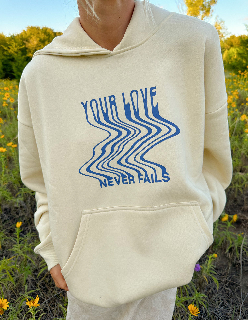 Elevated Faith Love Never Fails Cream Unisex Hoodie - AVBL MRKT (3)