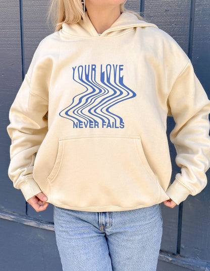Elevated Faith Love Never Fails Cream Unisex Hoodie - AVBL MRKT (5)