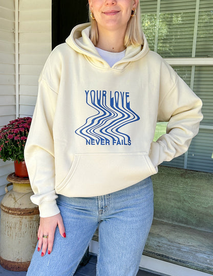 Elevated Faith Love Never Fails Cream Unisex Hoodie - AVBL MRKT (8)